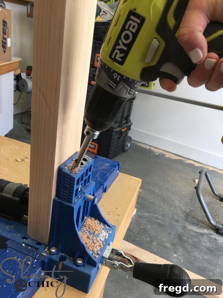 Using a Kreg Jig K5 to drill precise pocket holes for strong woodworking joints.