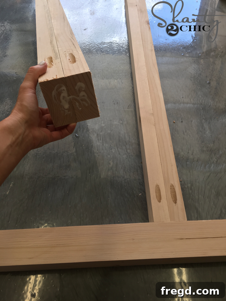 Attaching the Legs: securing laminated leg components to the table base structure.