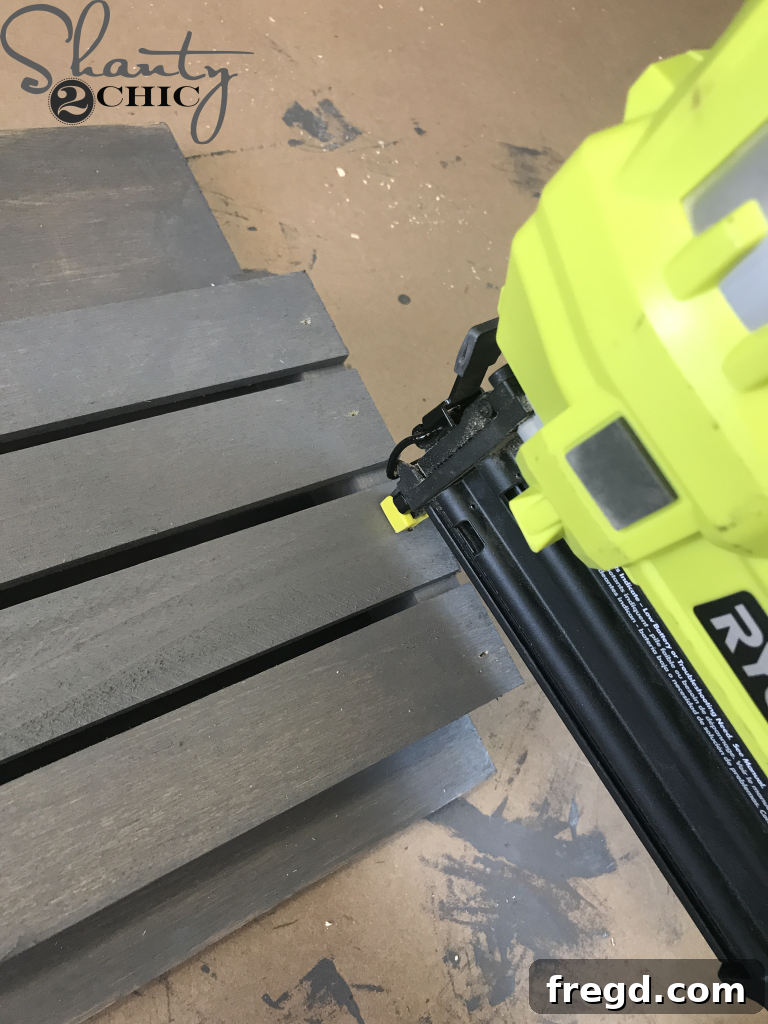 Applying Briarsmoke stain to the mail sorter