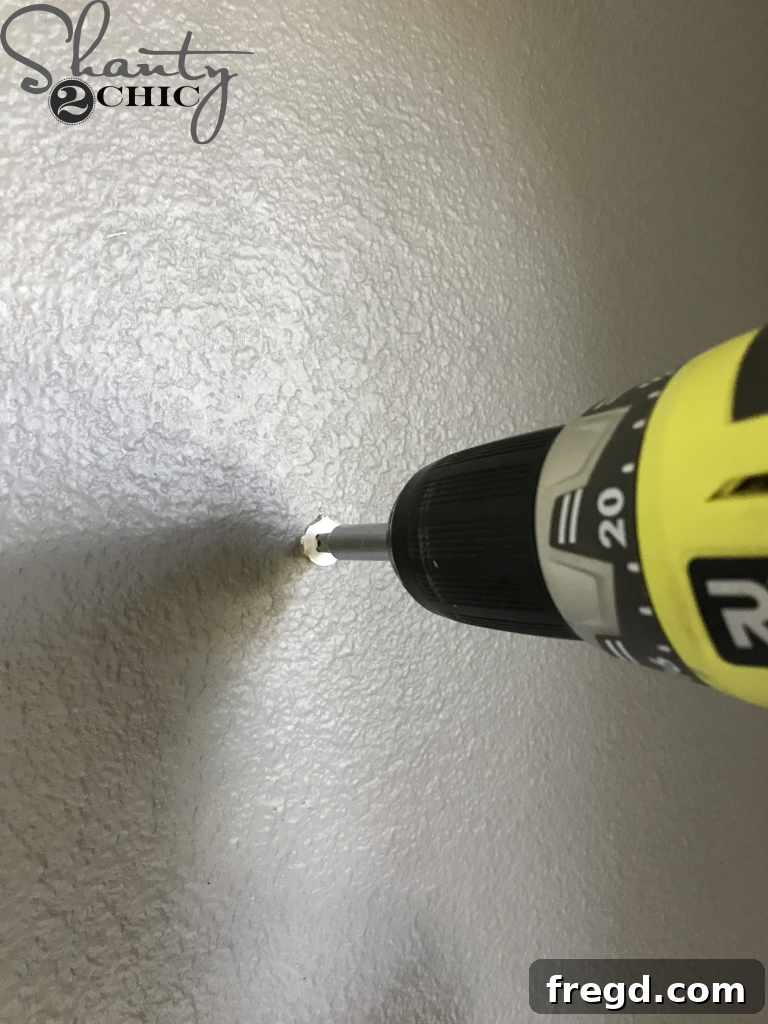 Predrilling holes for wall mounting the DIY organizer