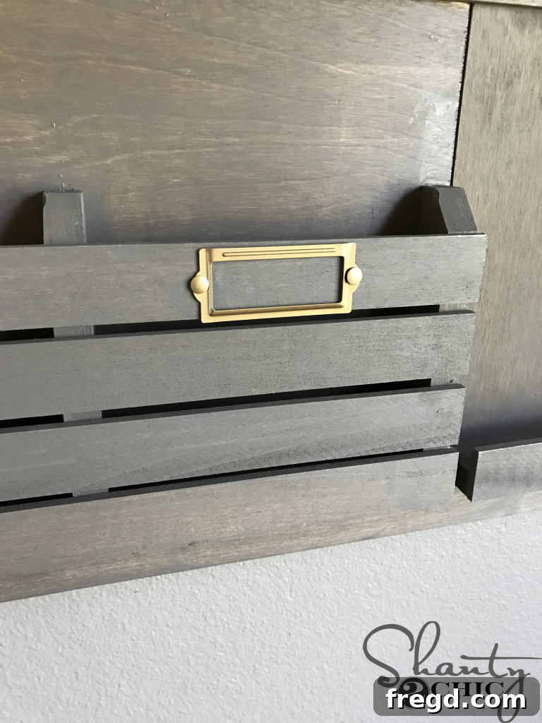 Spray painting label holders with Satin Bronze