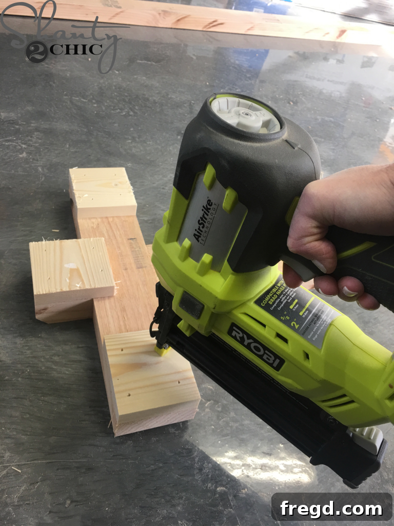 Applying wood glue to the support ends and feet of the inverted bench base