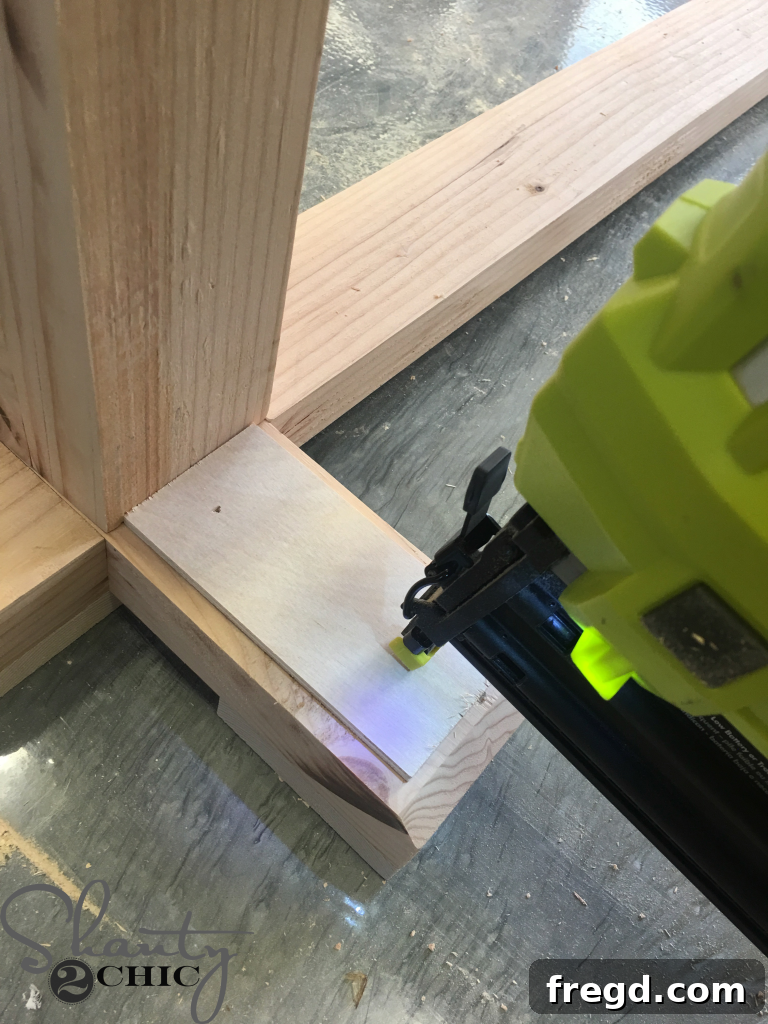 Securing the bench top to the upper supports of the base