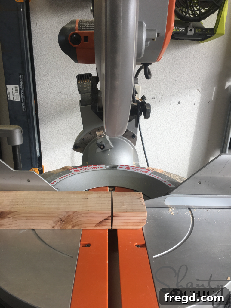 Making the corner cut on a longer piece of wood before cutting the foot