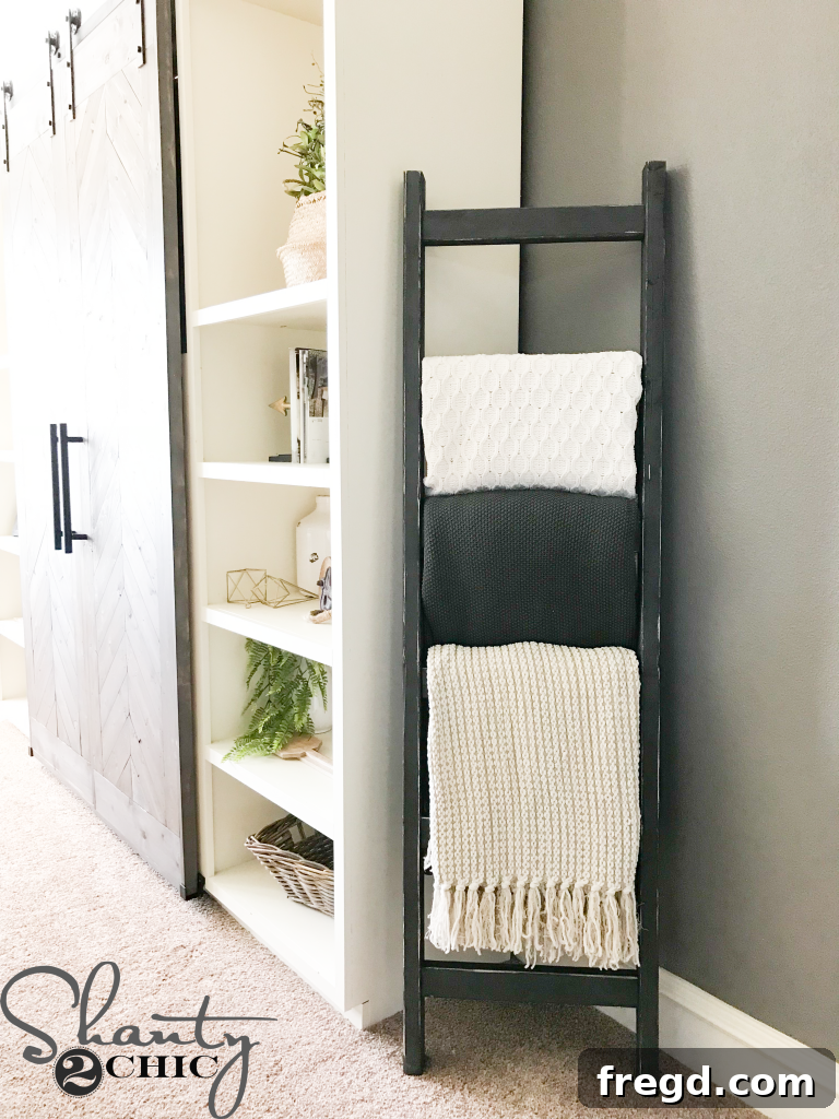 Textured blankets draped over a rustic wooden ladder
