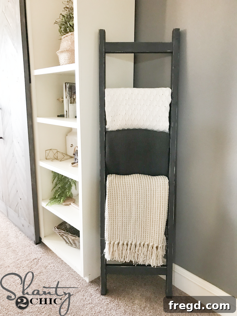 Close-up of a rustic blanket ladder showing distressed finish
