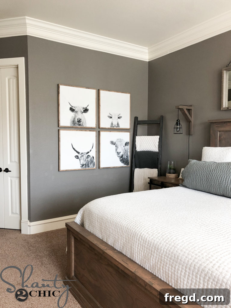 Finished DIY cow print art elegantly displayed in a bedroom with farmhouse decor accents