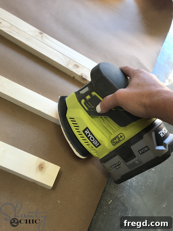 Cutting individual wood trim pieces to size for the DIY cow print frames