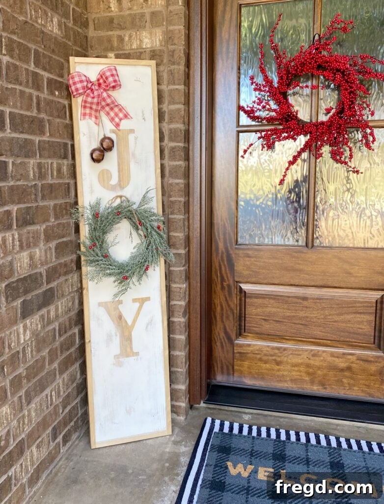DIY Porch Sign featuring a festive message, perfect for seasonal outdoor decoration and welcoming guests.