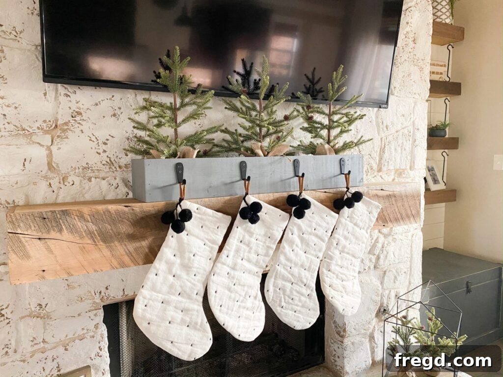 Rustic DIY Stocking Holder for Christmas decor, crafted from wood, perfect for mantel displays.