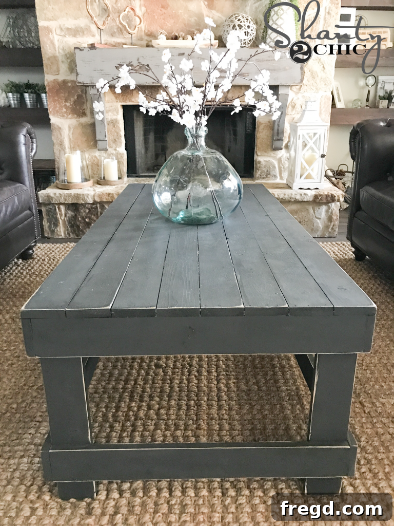 Cozy living room corner with fireplace, DIY mantel, and rustic coffee table