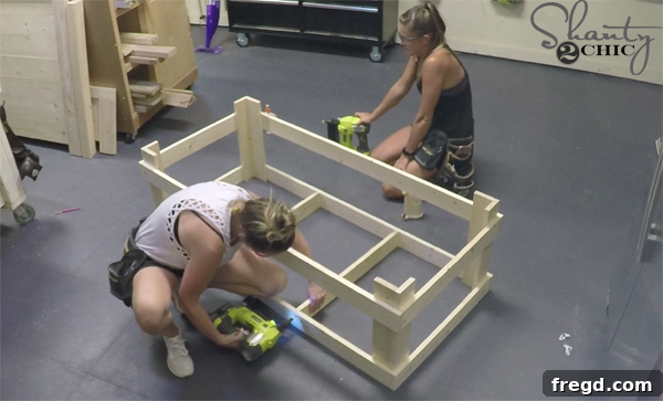 Connecting coffee table leg assemblies with long apron pieces for the main frame
