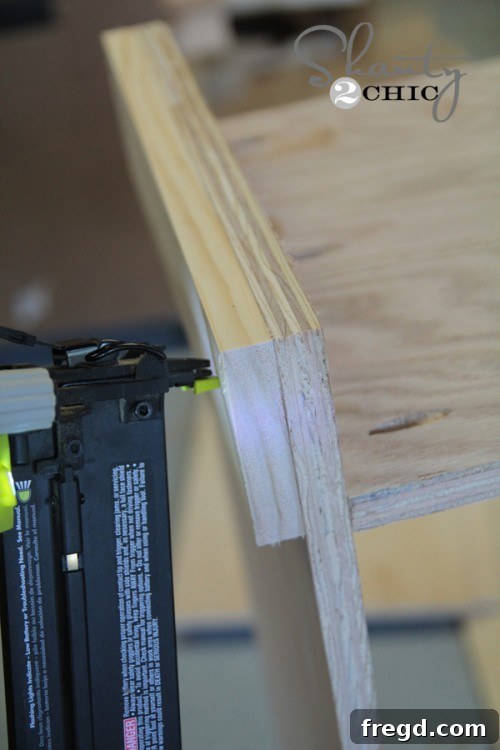 Attaching side base boards to the DIY cabinet for added stability and finish