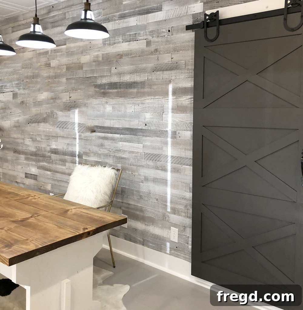 Applying wood filler and painting the DIY sliding barn door hack