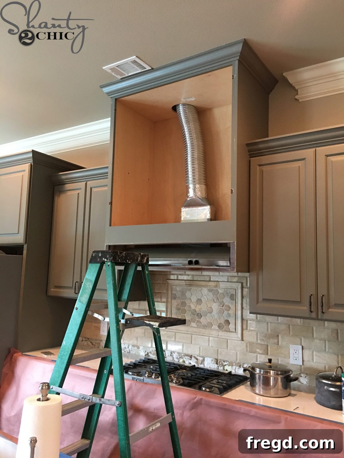 Craft Your Own Barn Door Range Hood 2 Before starting the DIY barn door vent hood project, carefully remove existing cabinet doors.