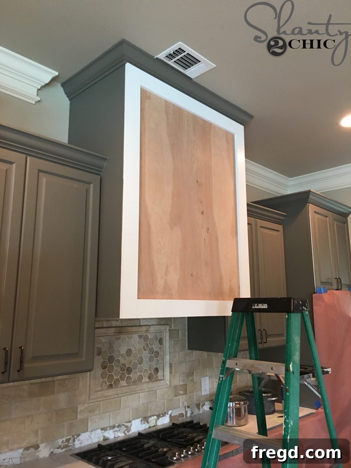 Craft Your Own Barn Door Range Hood 8 A close-up view showing the flush alignment of the 1x4 trim with the plywood edges.