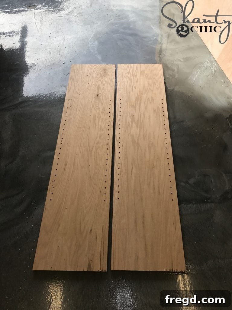 Continuing to drill shelf pin holes down the cabinet side