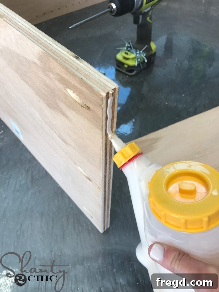 Drilling pocket holes into cabinet panels with Kreg Pocket Hole Jig