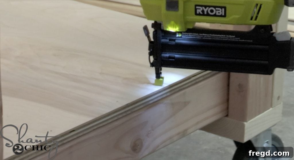 Crafting Your Ultimate Workspace 9 Attaching the bottom shelf of the DIY workbench