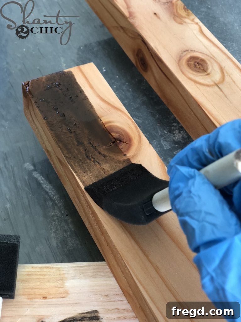 Rustic Barn Door Blanket Ladder 7 Applying Wood Stain to Ladder