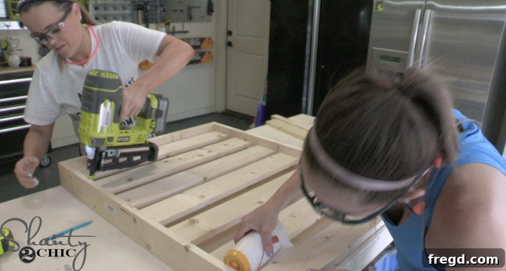Attaching the footboard to the side pieces of the dog bed frame