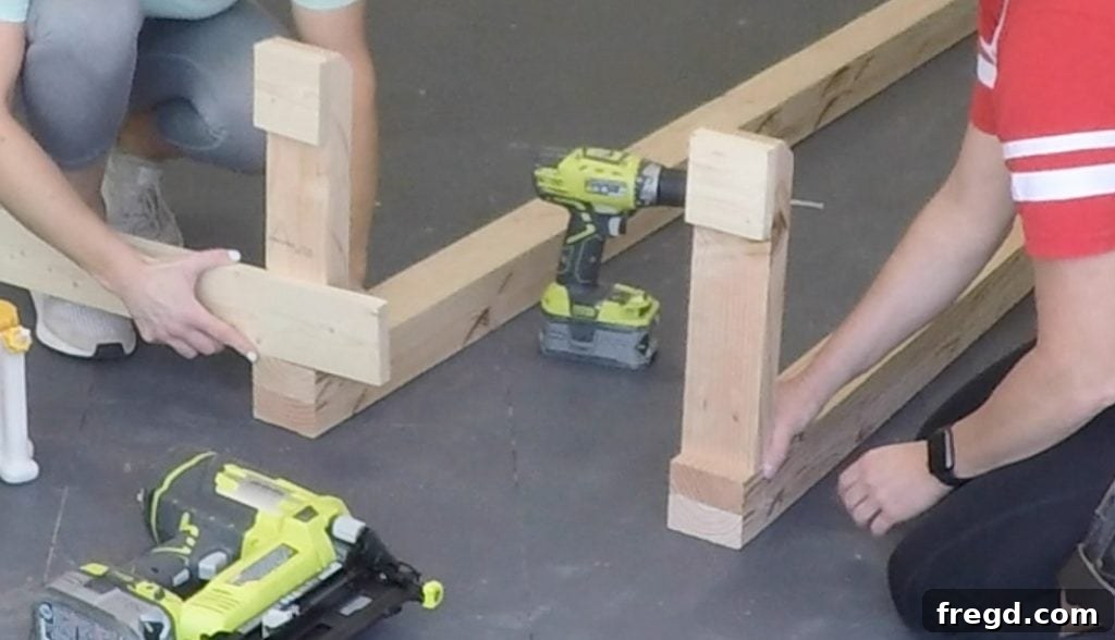 DIY Modern Farmhouse Entryway Organizer 7 Attaching foot pads to the hall tree legs