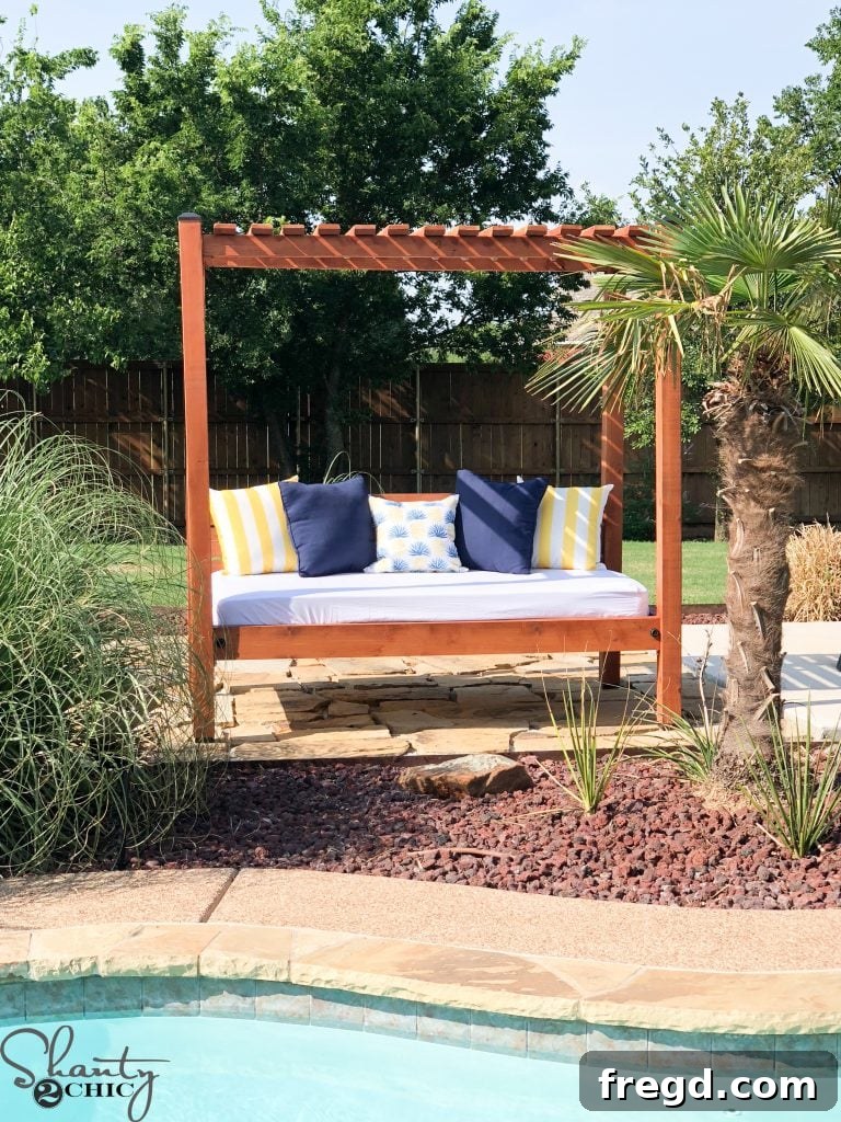 A beautifully finished DIY Outdoor Day Bed with wooden framework and comfortable seating
