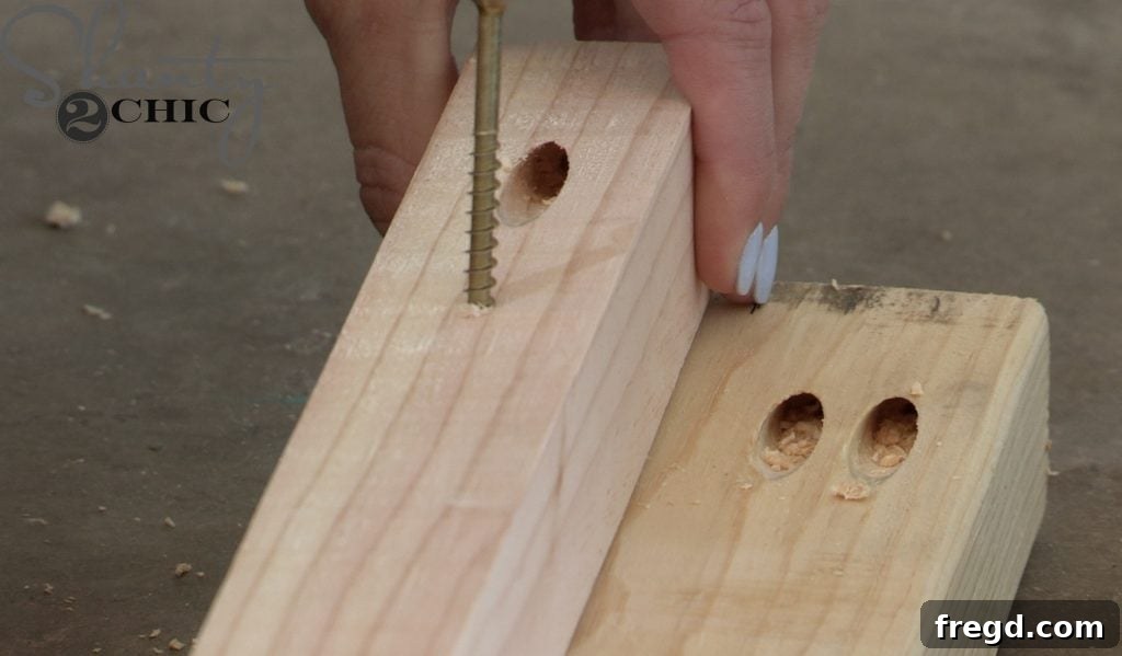 Attaching top side frames with metal angles and screws to the main posts