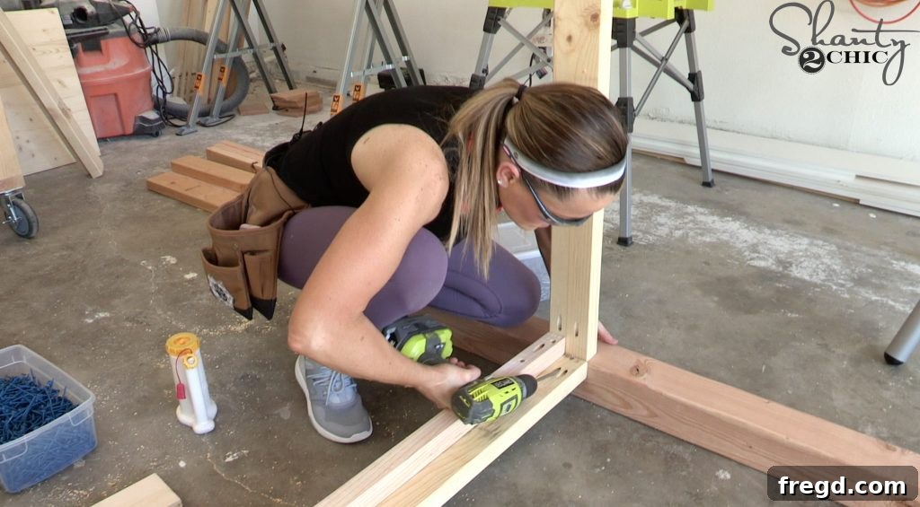 Drilling pocket holes into front and back frame pieces with a Kreg Jig