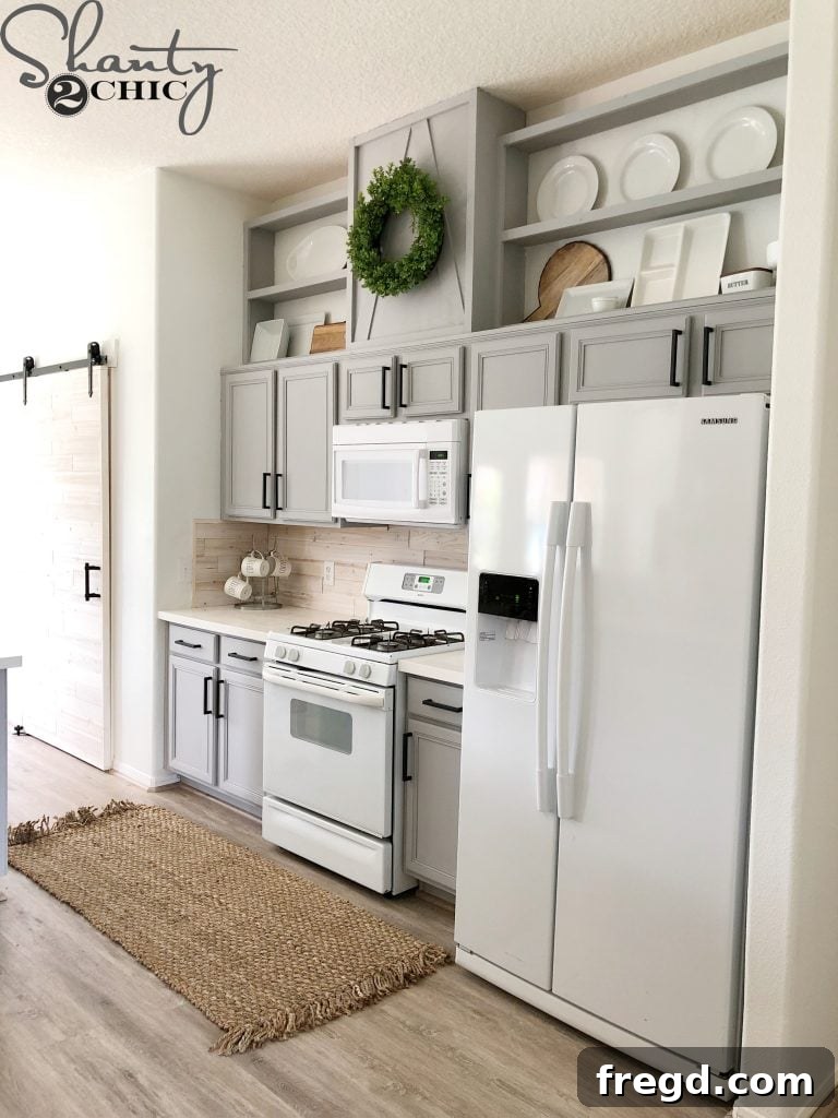 After photo showing dramatically taller and updated kitchen cabinets