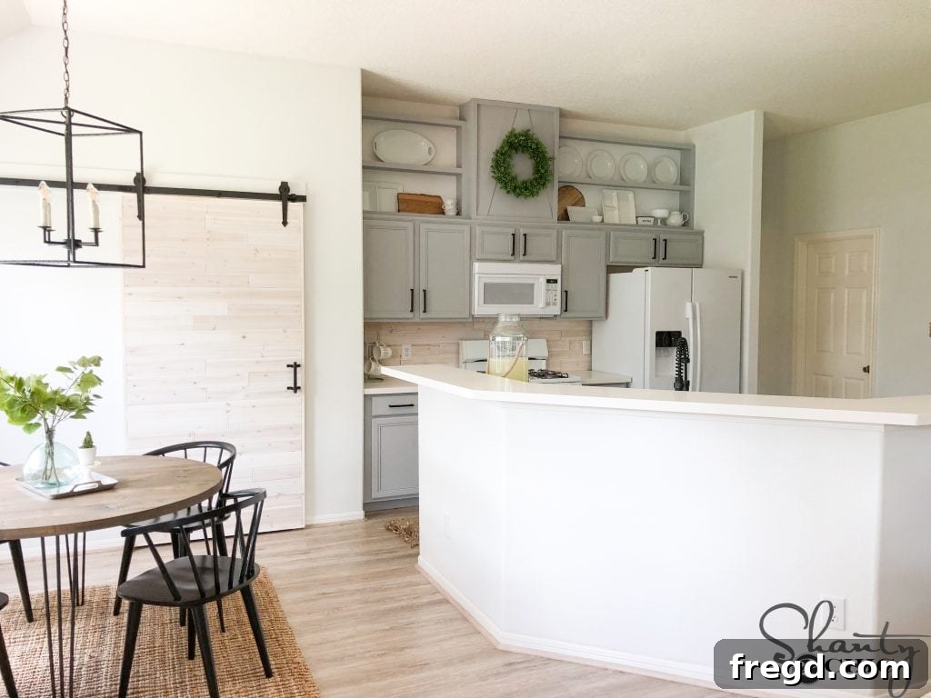 Another perspective of the transformed kitchen with added cabinet height