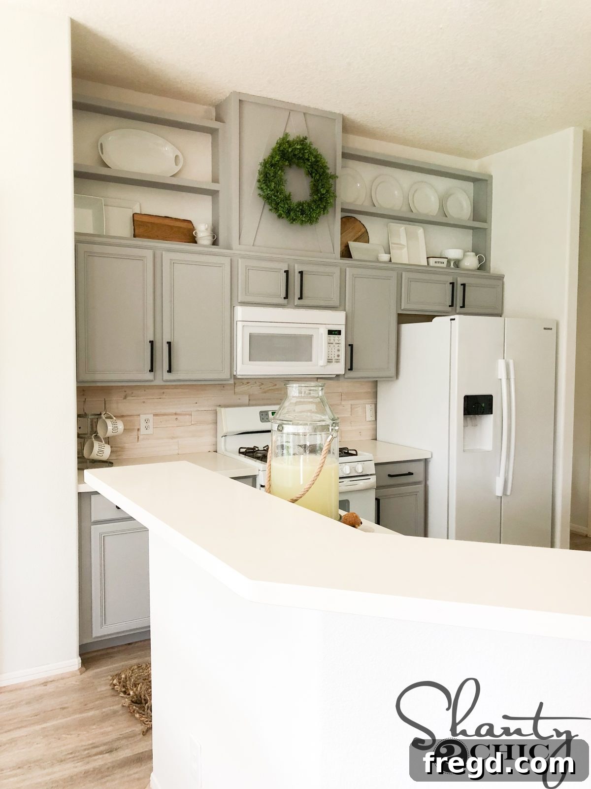 Full view of the stylish, extended kitchen cabinets showcasing the DIY upgrade