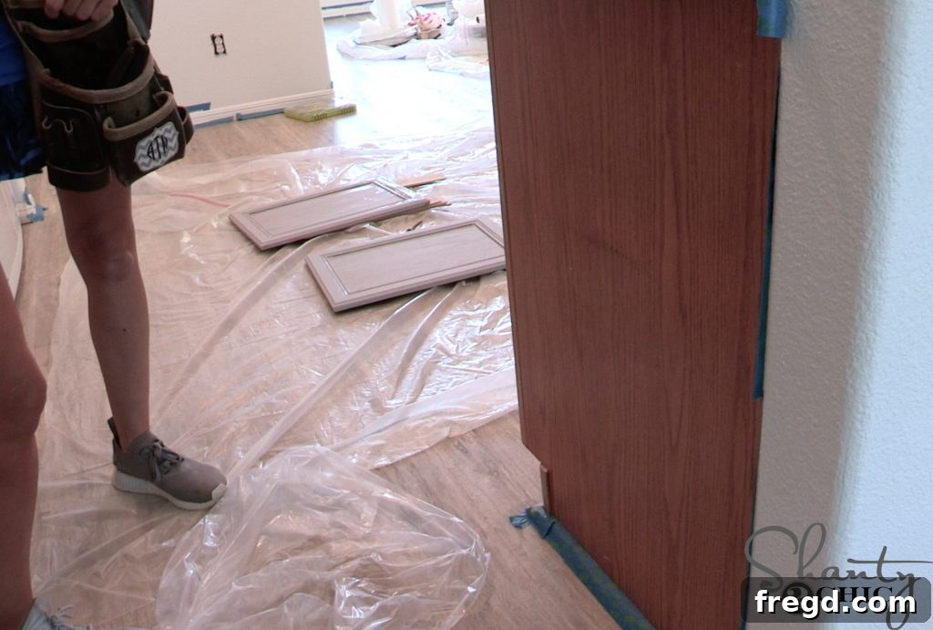 Builder-Grade Cabinets before custom upgrade showing a blank end panel