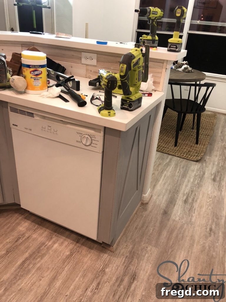 Freshly painted custom-look builder-grade cabinets in a kitchen