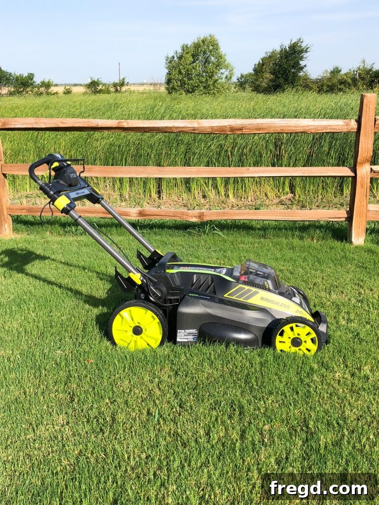 Ryobi 40V Mower in a serene backyard setting, showcasing its modern design.