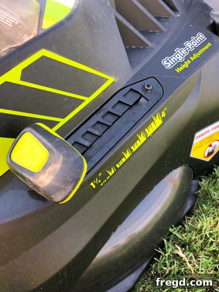 Detail shot of the Ryobi 40V mower's single-point height adjustment lever.