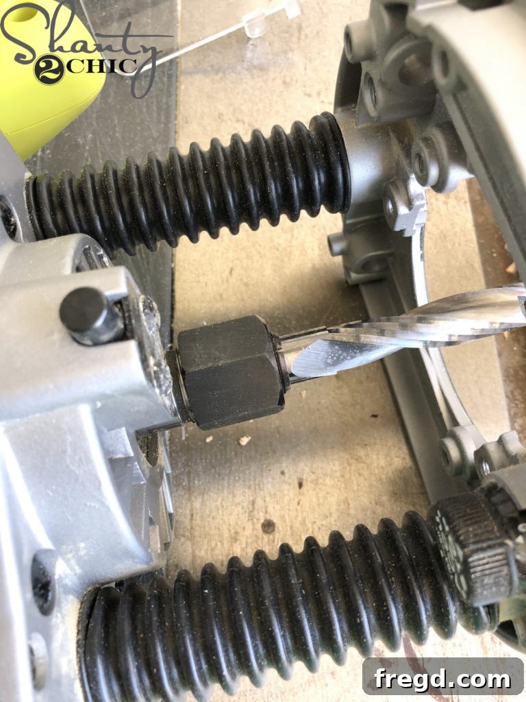 The final step of tightening the router bit and replacing the protective plastic guard
