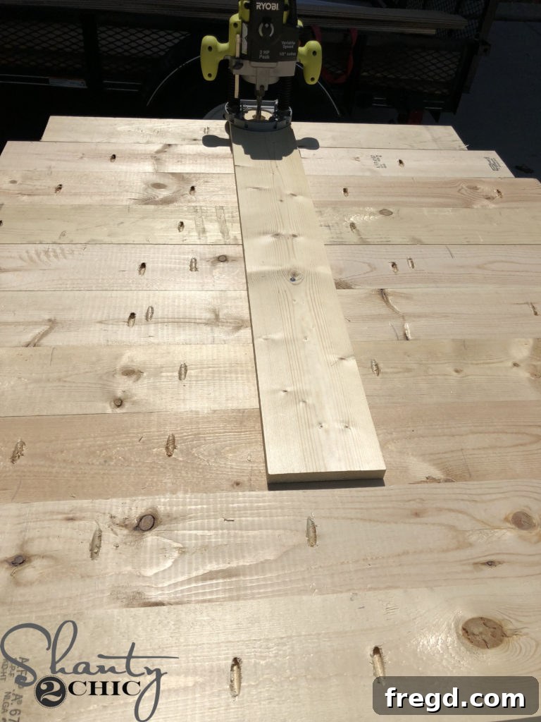Securing the router jig to the exact center of the tabletop blank using the pivot screw