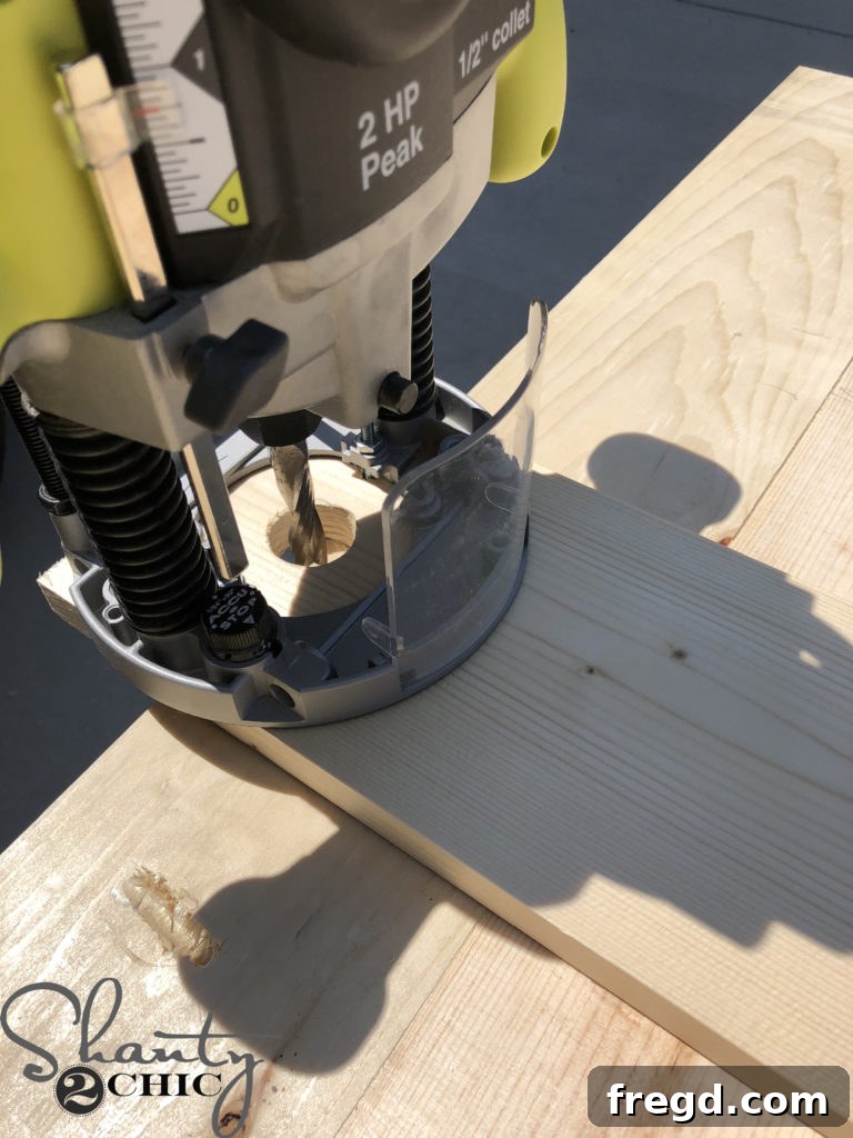 Adjusting and setting the plunge depth on the router for the initial, shallow cutting pass