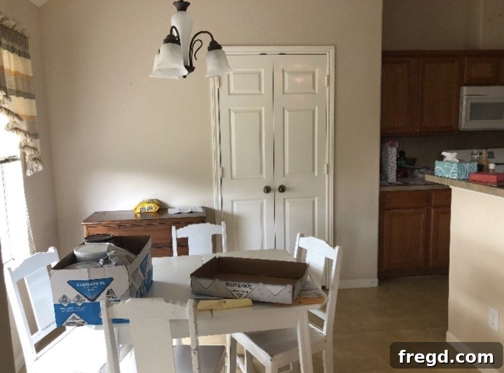 Beautifully finished custom sliding barn door on a pantry, adding rustic charm to the home interior.