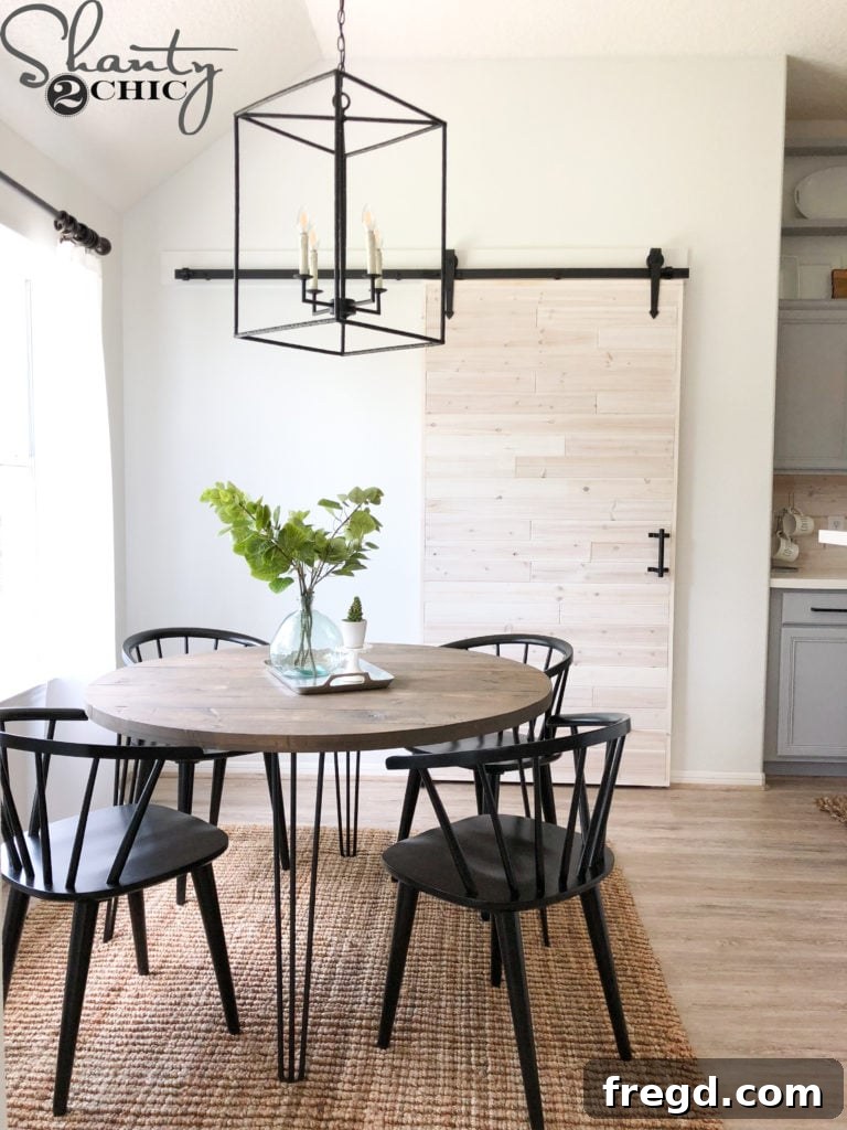A wider view of the room's layout before the stylish barn door was installed, showing the original doorway.