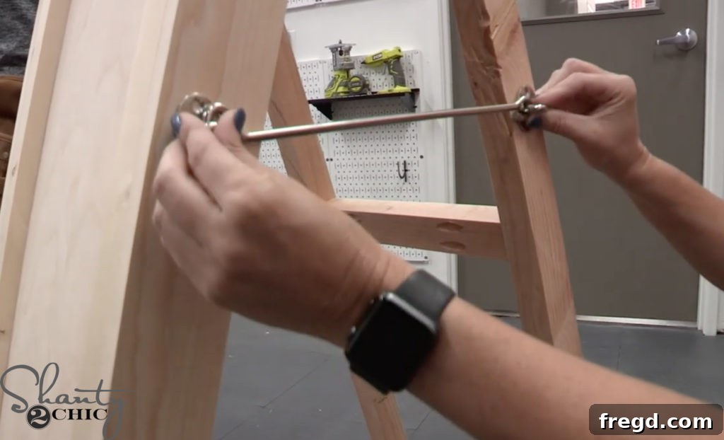Adding optional decorative corner hardware to the easel mirror frame