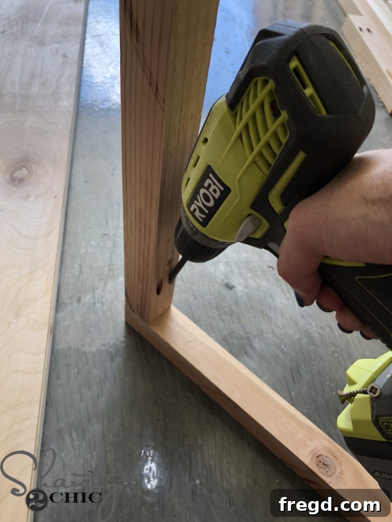 Kreg Jig in action, drilling pocket holes for the easel ladder frame components