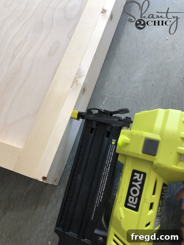 Using the ladder frame as a spacer while attaching side trim to the main mirror frame