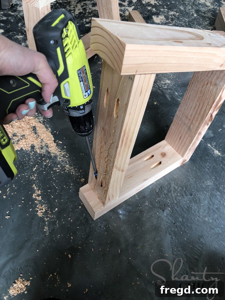 Attaching leg runners to the V-shaped bench legs for stability