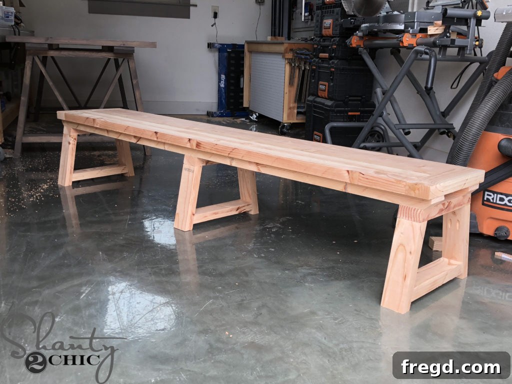 Final assembly: attaching the planked bench top to the completed leg base