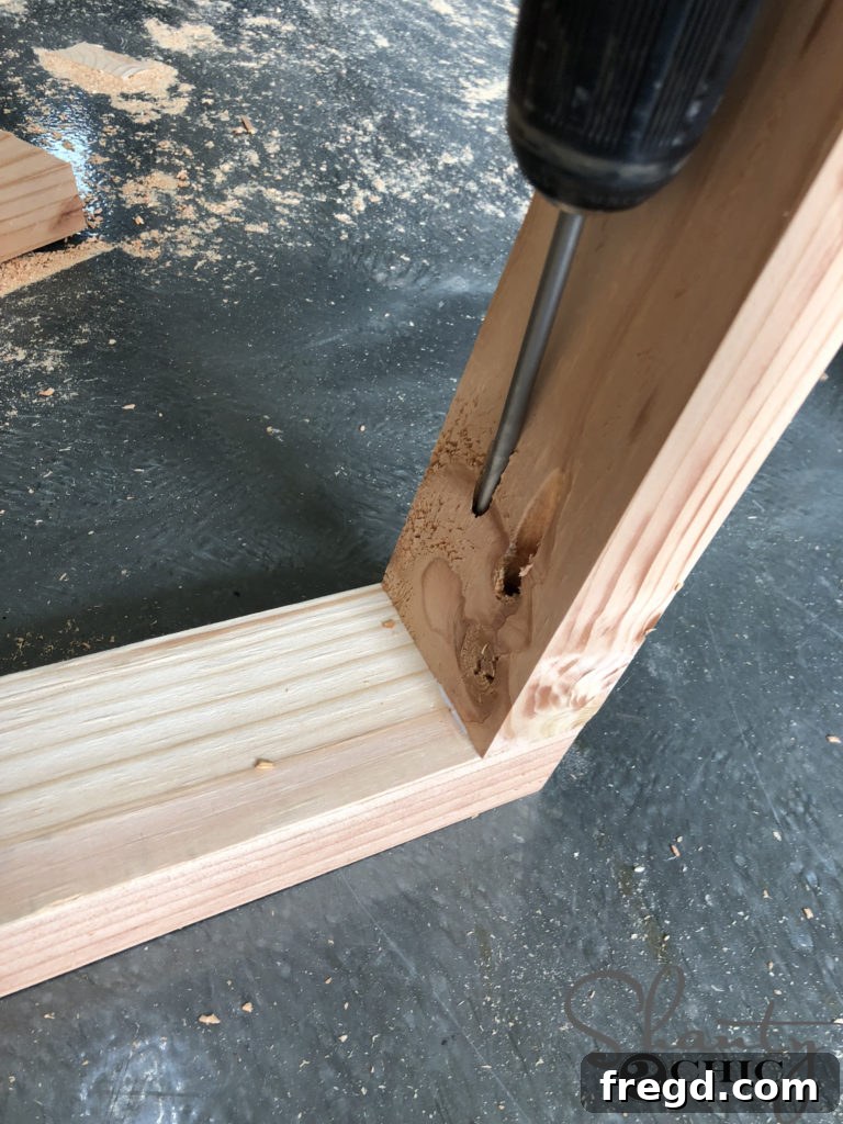 Attaching legs to the top cross-piece of the bench base