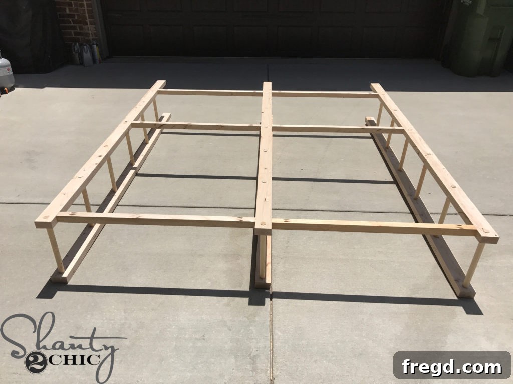 Craft Your Own Modern Farmhouse Dish Display 12 Three assembled ladders forming the main frame of the plate rack