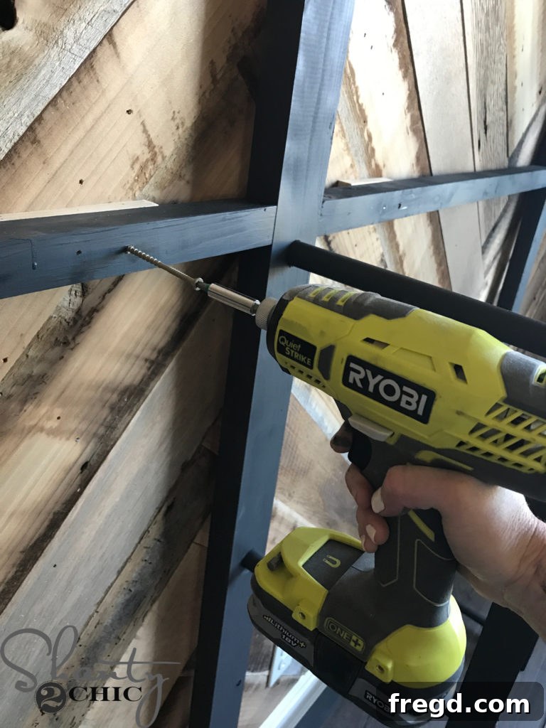 Craft Your Own Modern Farmhouse Dish Display 18 Attaching scrap wood shims behind the plate rack cleats to compensate for base trim