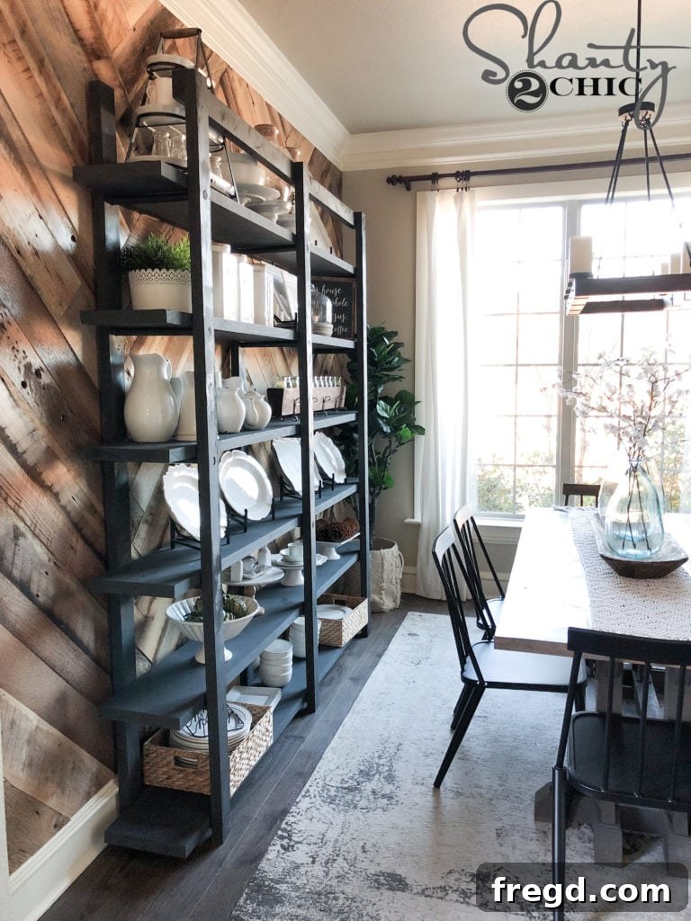 Close-up of the completed DIY Modern Farmhouse Plate Rack filled with plates and greenery